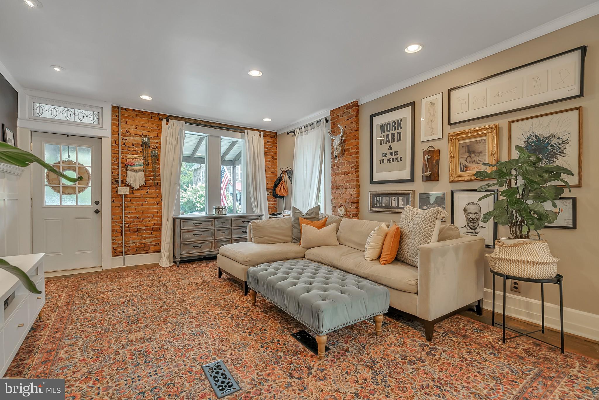 229 Benezet Street Philadelphia, PA 19118 - Photo 9 of 36 a living room with furniture and a large window