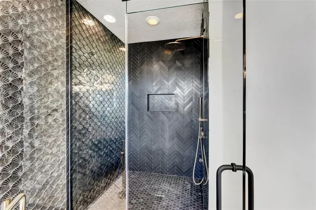 a view of a hallway with wooden floor and windows