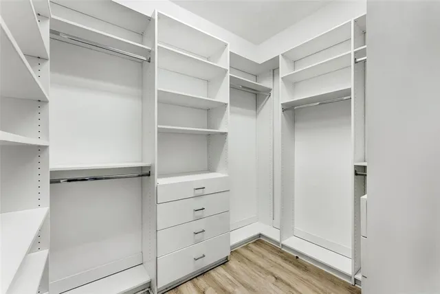 a bathroom with a shower and a sink