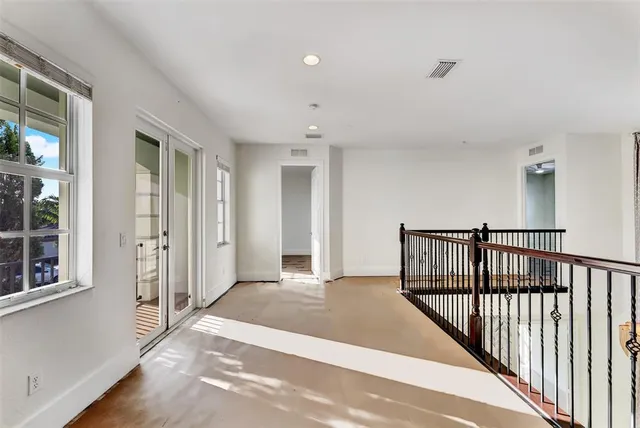 a kitchen with stainless steel appliances granite countertop a refrigerator a sink and a stove top oven