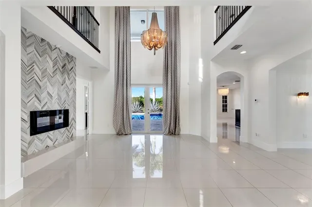 a view interior of a house with an entryway and fire place