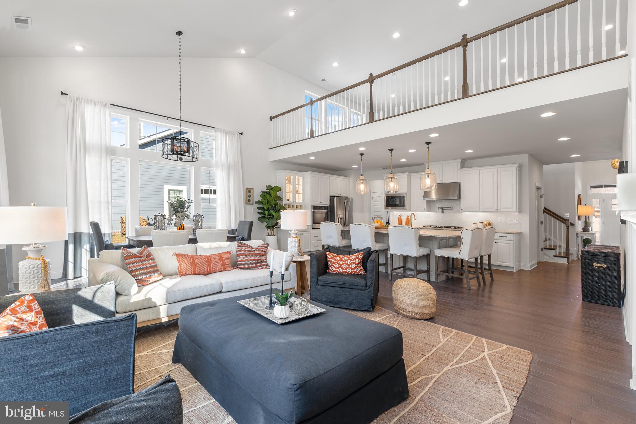 19482 Safflower Way Lewes, DE 19958 - Photo 2 of 19 a living room with furniture kitchen view and a wooden floor