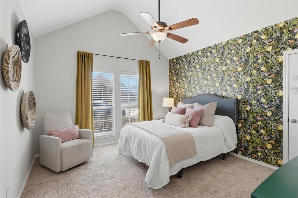 7224 Prestwick Terrace Benbrook, TX 76126 - Photo 16 of 26 Inviting secondary bedroom with impressive vaulted ceilings and generous natural light.