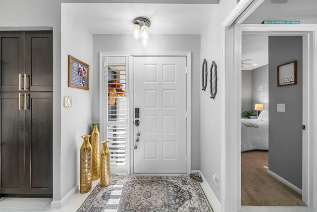a view of room with hallway and wooden floor
