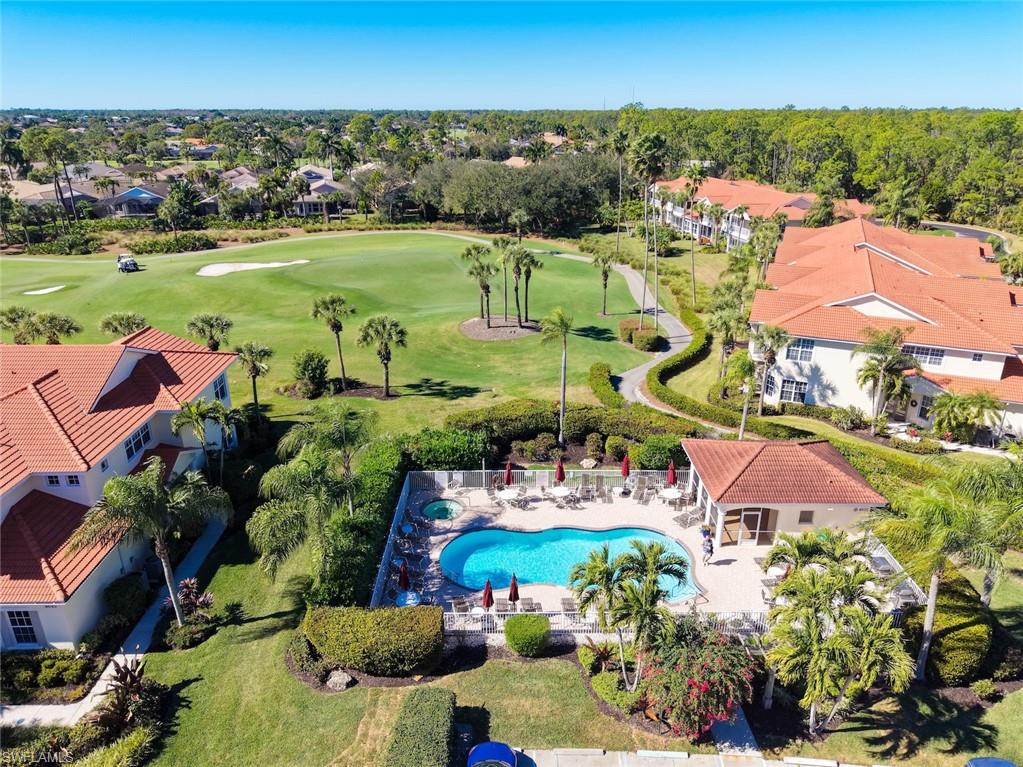 4630 Winged Foot Court, Unit 101 Naples, FL 34112 - Photo 23 of 43 an aerial view of residential houses with outdoor space and lake view