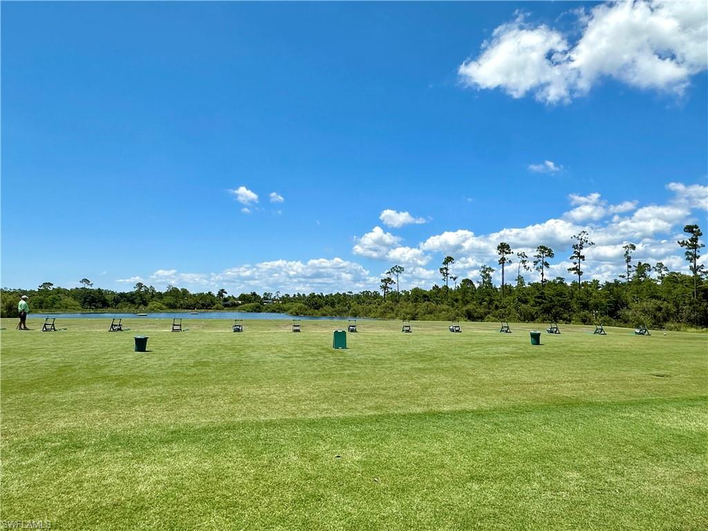 4630 Winged Foot Court, Unit 101 Naples, FL 34112 - Photo 27 of 43 a view of a golf course with an ocean
