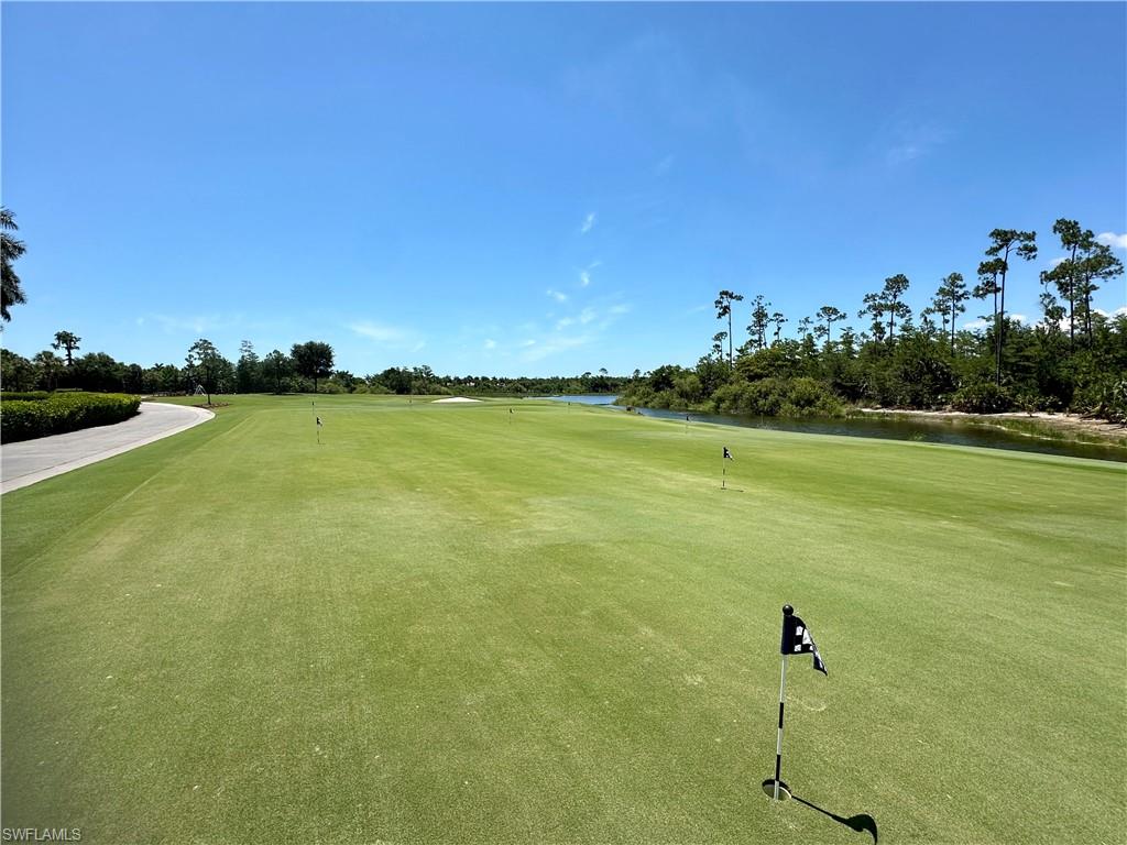 4630 Winged Foot Court, Unit 101 Naples, FL 34112 - Photo 28 of 43 a view of an ocean and beach