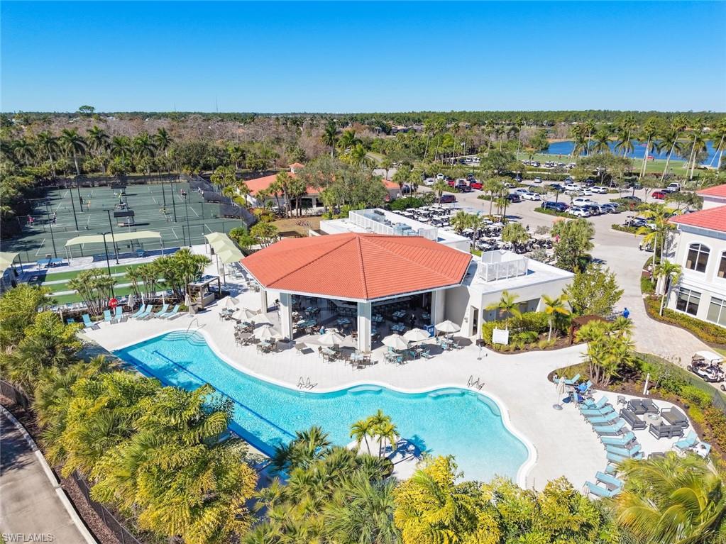 4630 Winged Foot Court, Unit 101 Naples, FL 34112 - Photo 30 of 43 a view of a swimming pool with an outdoor seating