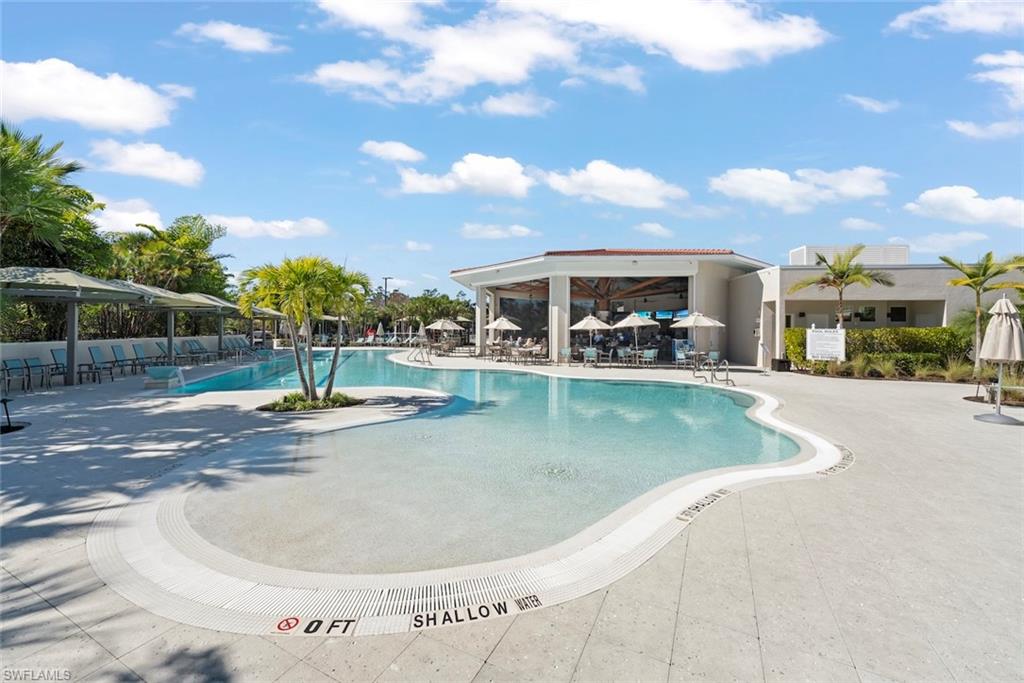 4630 Winged Foot Court, Unit 101 Naples, FL 34112 - Photo 32 of 43 a view of a house with swimming pool
