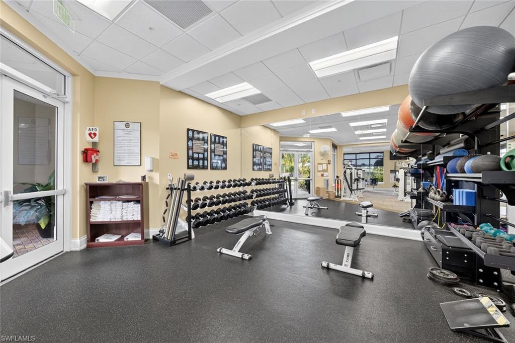 4630 Winged Foot Court, Unit 101 Naples, FL 34112 - Photo 37 of 43 a view of a room with gym equipment