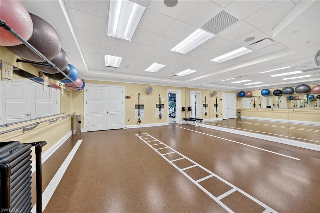 4630 Winged Foot Court, Unit 101 Naples, FL 34112 - Photo 38 of 43 a view of a room with lots of gym equipment