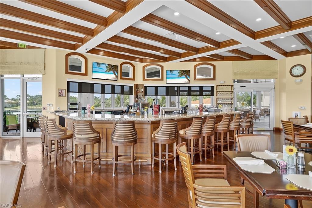 4630 Winged Foot Court, Unit 101 Naples, FL 34112 - Photo 40 of 43 a dining hall with lots of wooden furniture