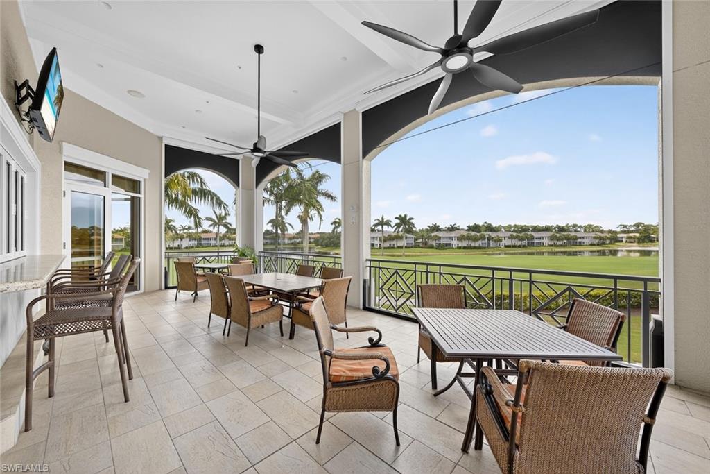 4630 Winged Foot Court, Unit 101 Naples, FL 34112 - Photo 42 of 43 an outdoor space with furniture and garden view
