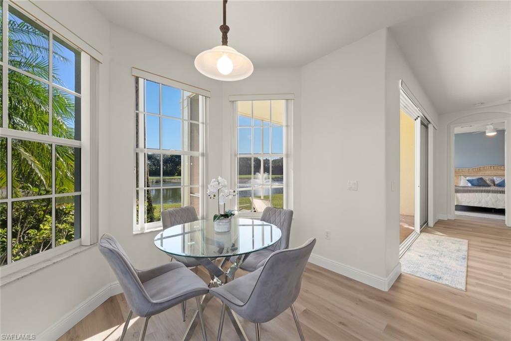 4630 Winged Foot Court, Unit 101 Naples, FL 34112 - Photo 7 of 43 a dining room with furniture and window