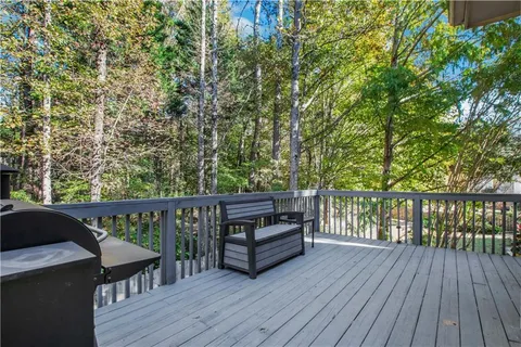 a view of deck with patio and wooden floor