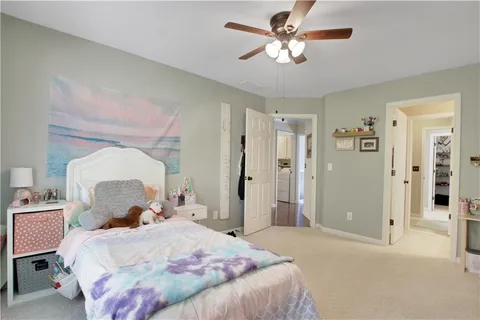 a bathroom with a sink vanity tub and shower