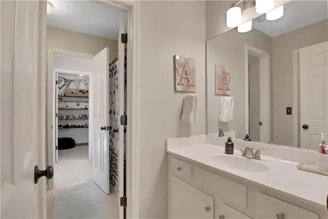 a bedroom with furniture and a chandelier