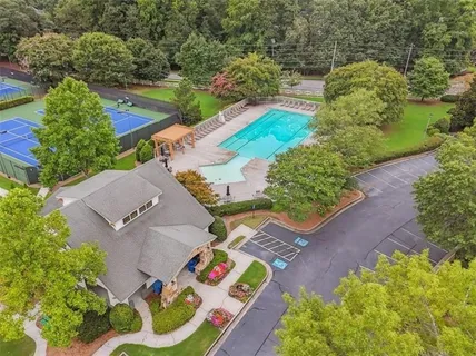 an aerial view of a house with a yard