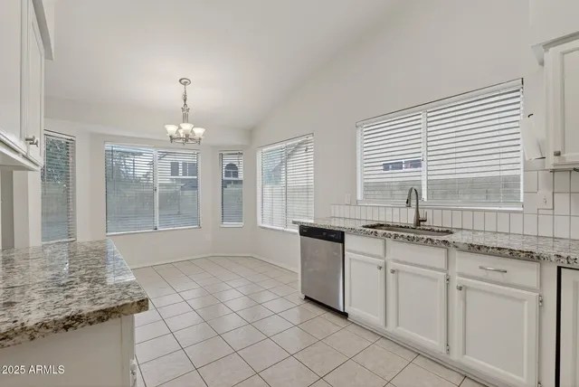 a kitchen with granite countertop white cabinets and a granite counter tops