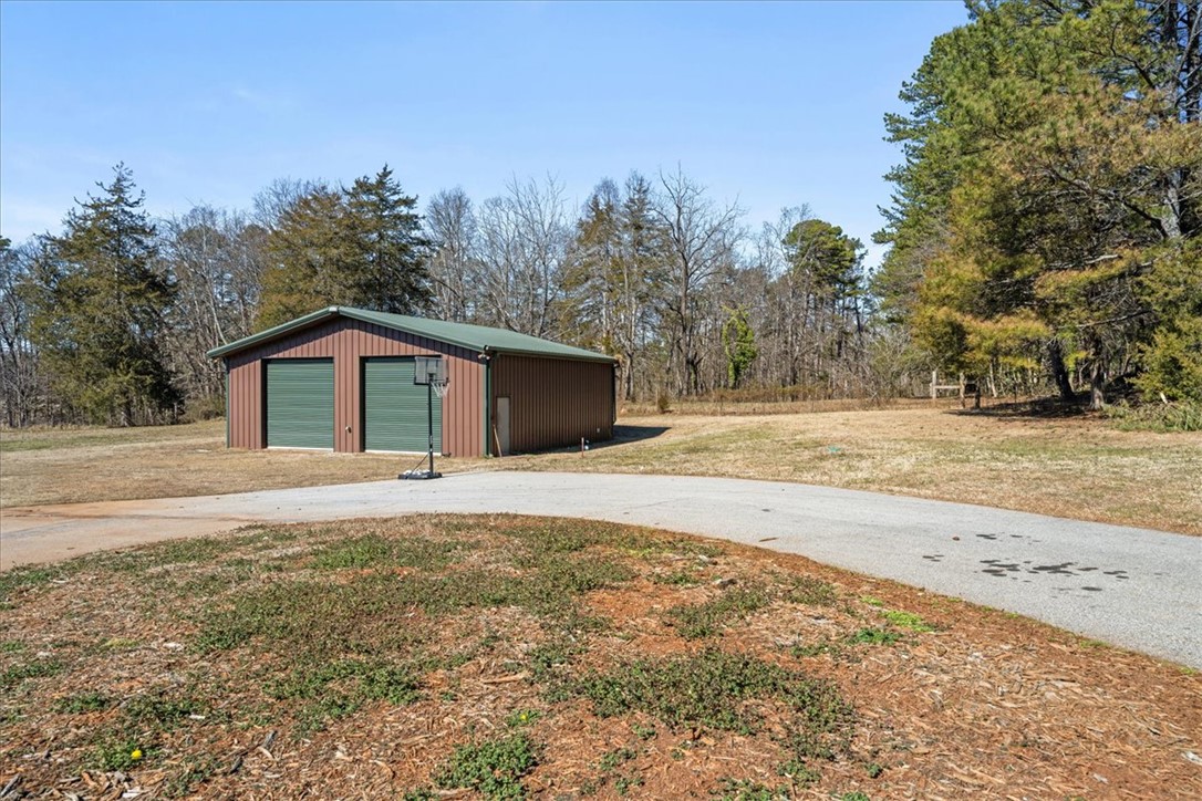 212 Winding Lane Seneca, SC 29672 - Photo 36 of 47 This property features a spacious garage, offering ample storage and utility for various needs.