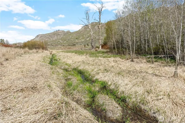 a view of a lake with mountains in the background
