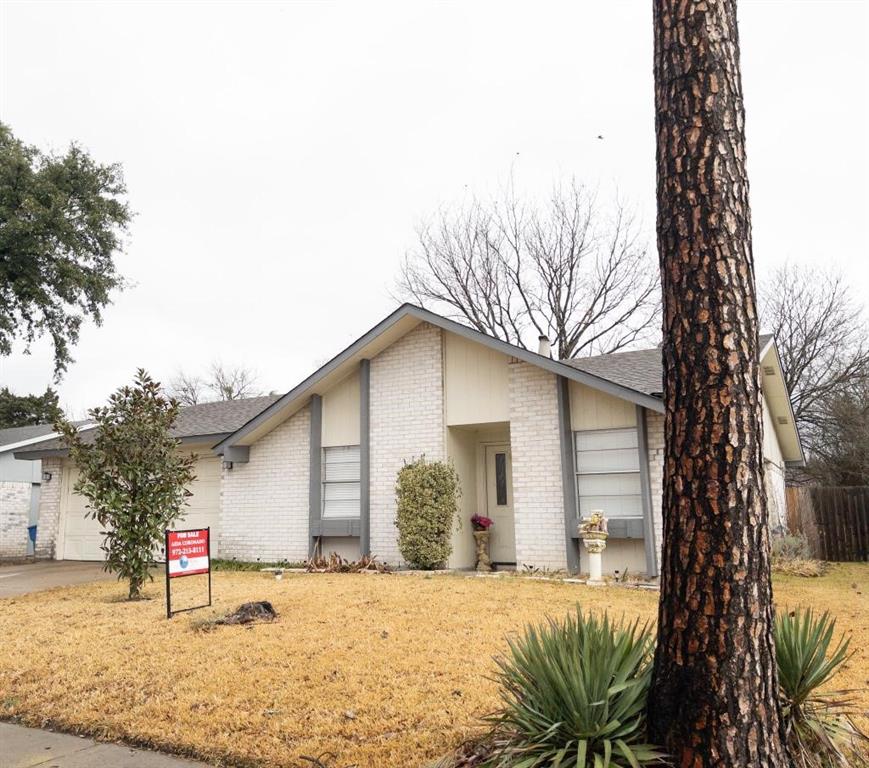 5913 Maple Lane Rowlett, TX 75089 - Photo 1 of 1 a front view of a house with a yard and garage