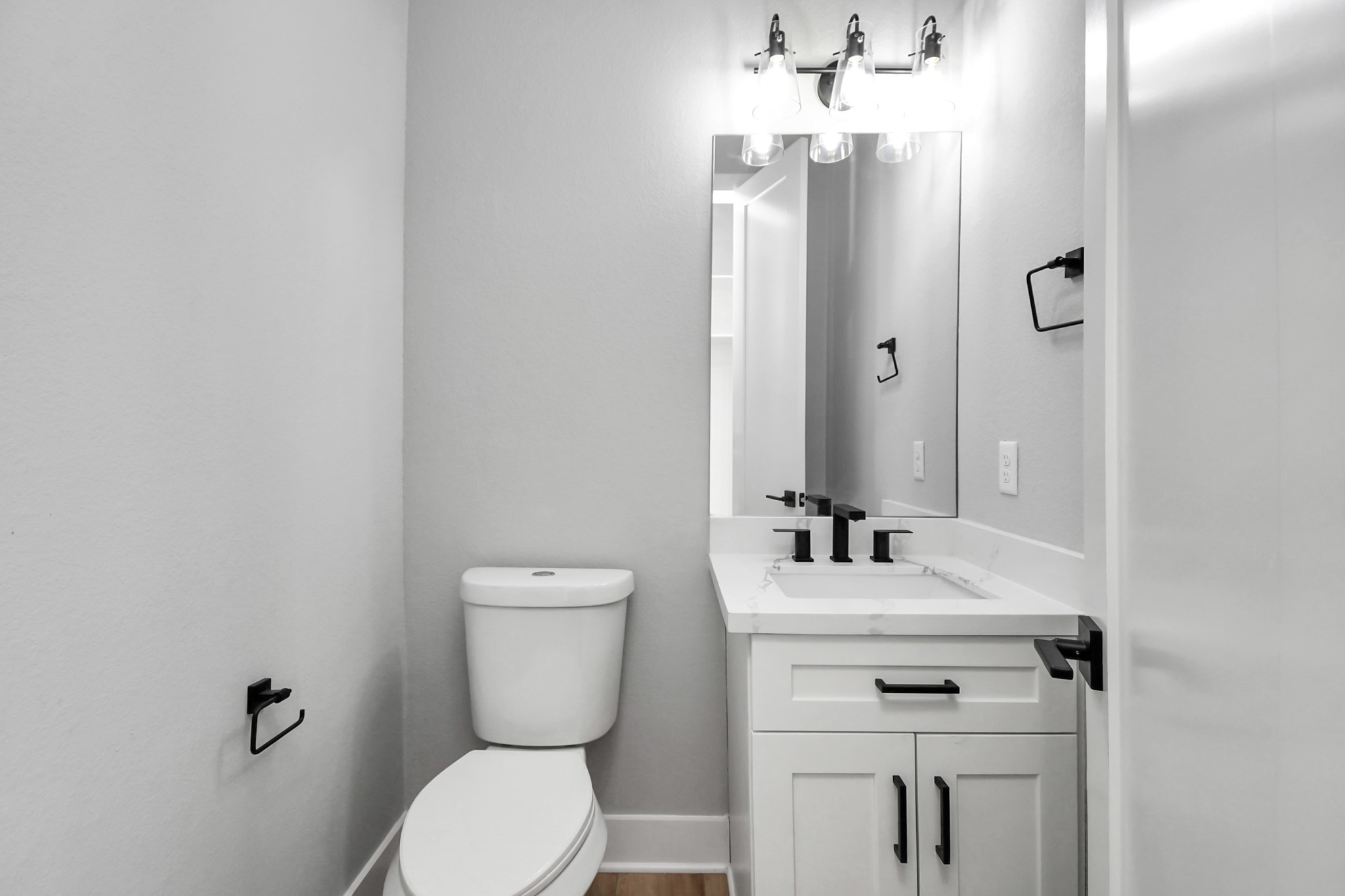 6817 Peerless Street Houston, TX 77021 - Photo 30 of 31 a bathroom with a sink toilet and mirror