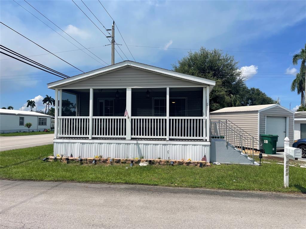 8581 Southwest 16th Street Davie, FL 33324 - Photo 1 of 12 a front view of a house with a garden