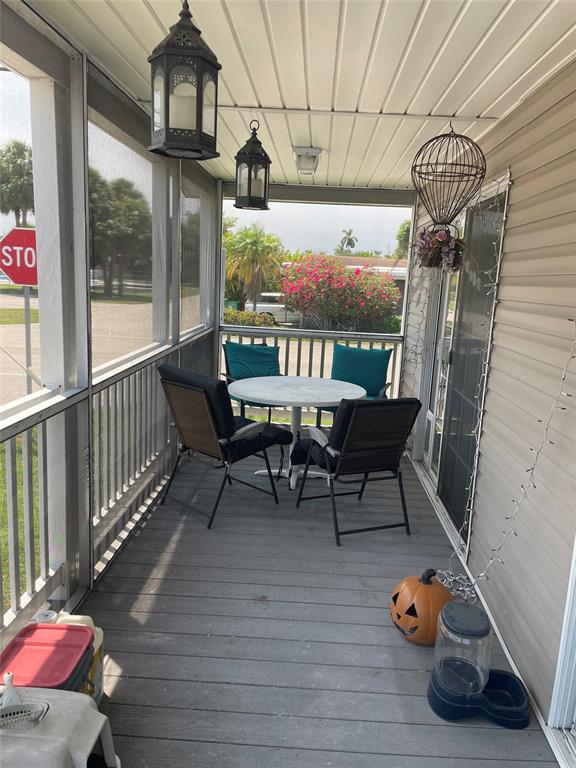 8581 Southwest 16th Street Davie, FL 33324 - Photo 3 of 12 a balcony with furniture and wooden floor