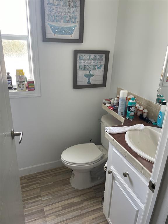 8581 Southwest 16th Street Davie, FL 33324 - Photo 10 of 12 a bathroom with a toilet a sink and a window