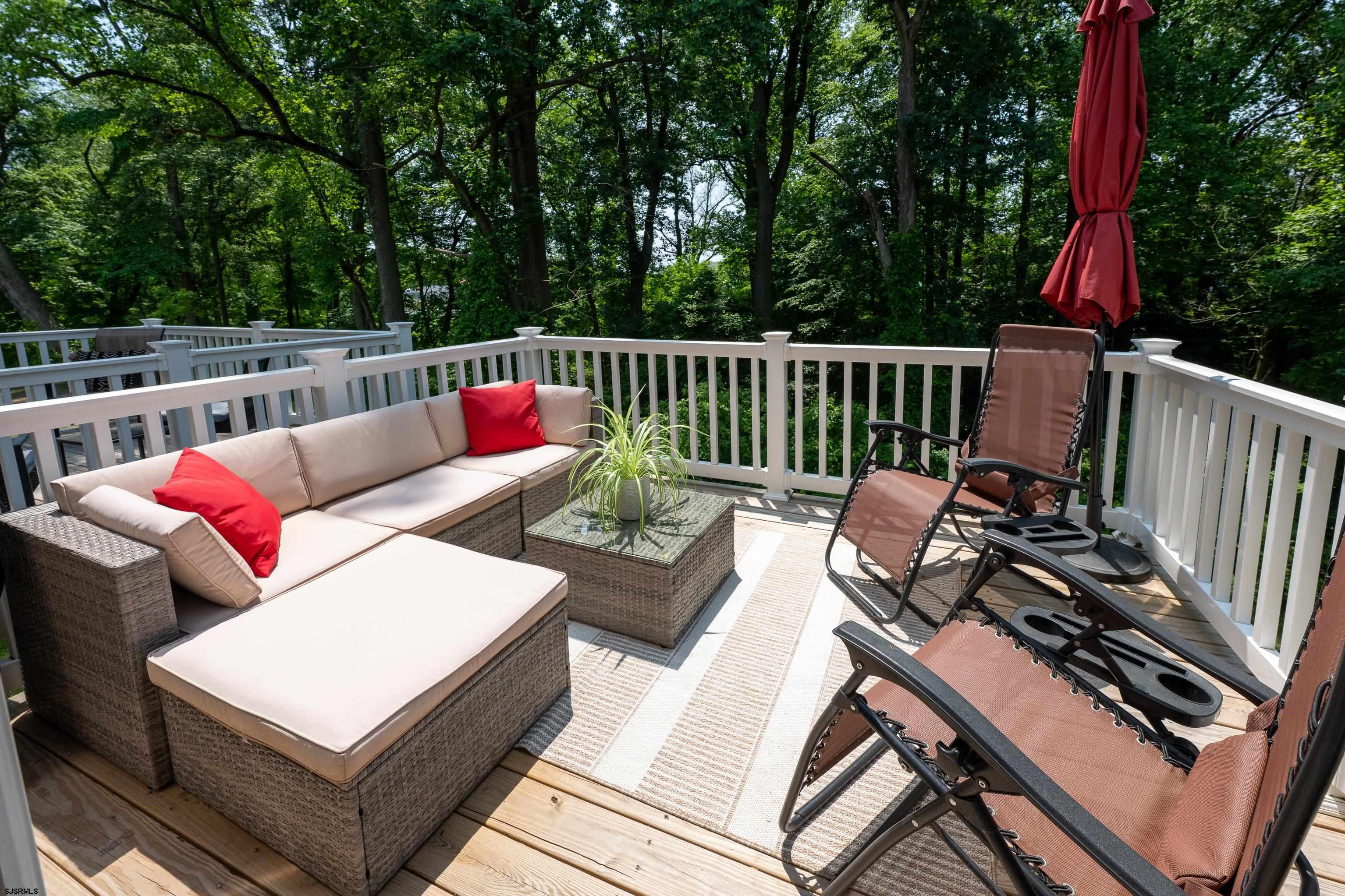 18 Lilac Circle Mount Laurel, NJ 08054 - Photo 23 of 52 a view of a patio with couches chairs and wooden fence