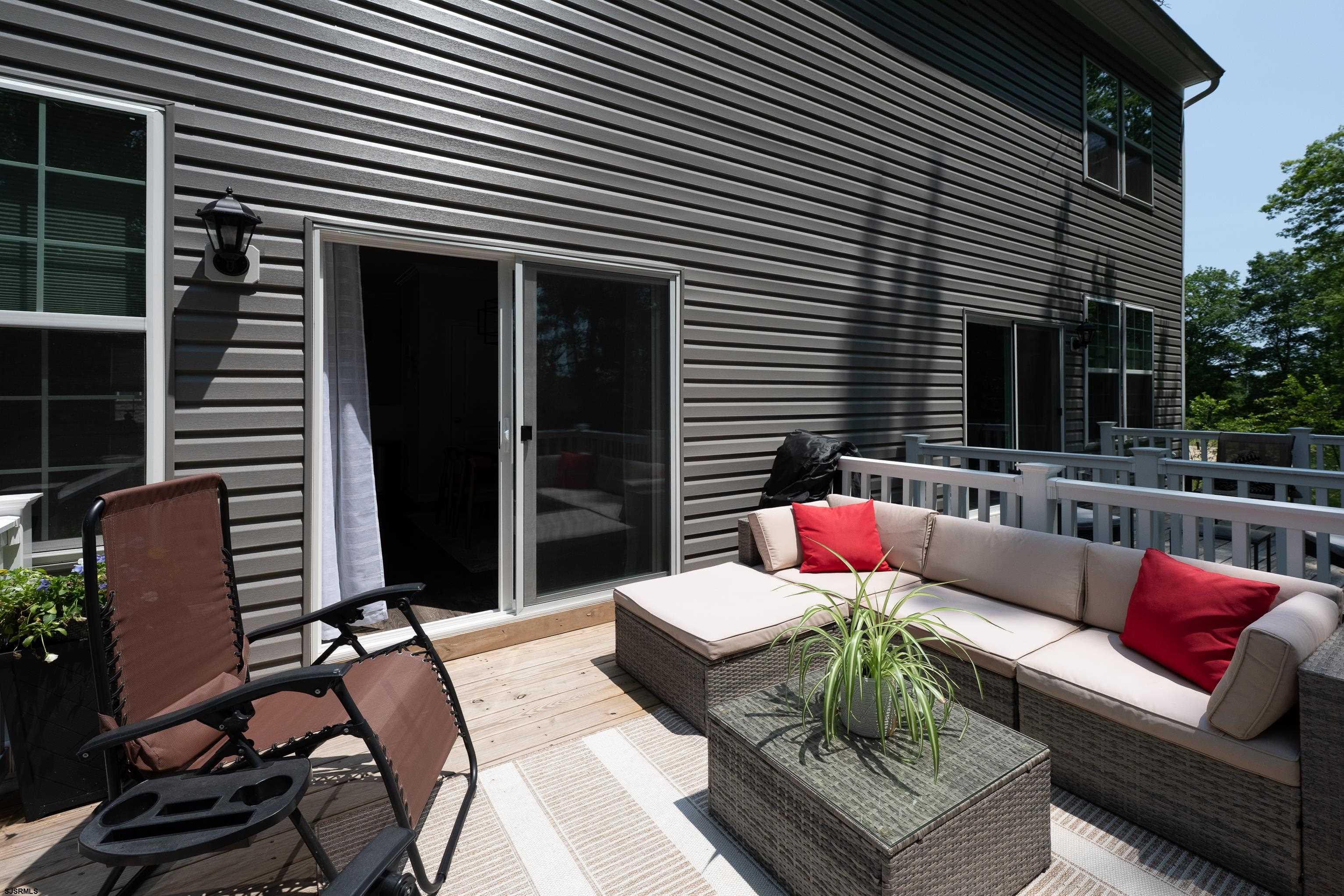 18 Lilac Circle Mount Laurel, NJ 08054 - Photo 24 of 52 a view of a patio with couches chairs and a potted plant