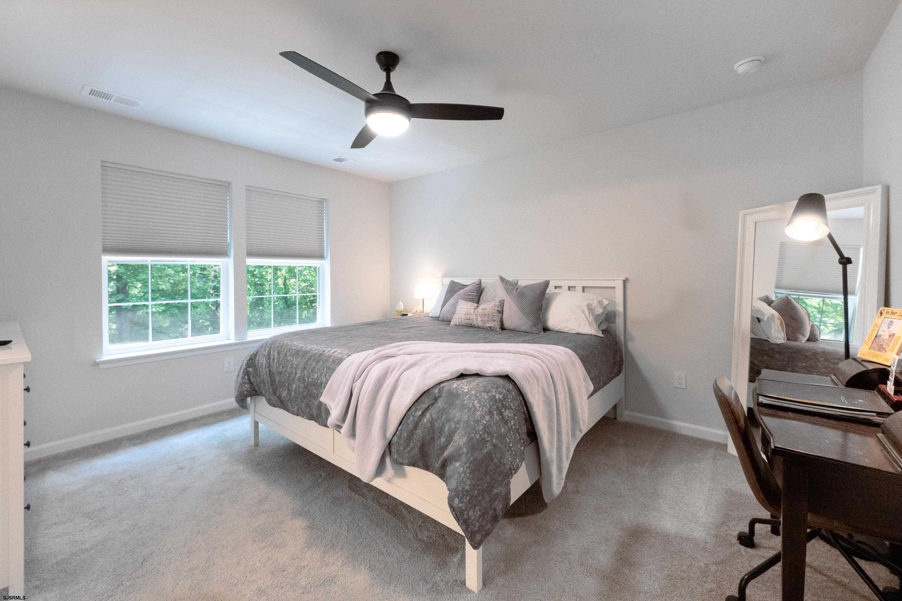 18 Lilac Circle Mount Laurel, NJ 08054 - Photo 29 of 52 a spacious bedroom with a bed and a window