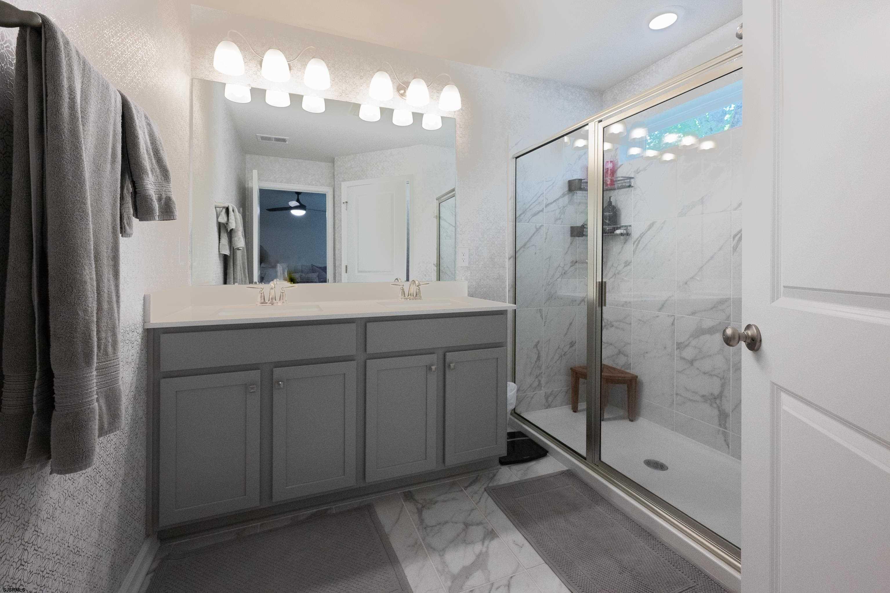 18 Lilac Circle Mount Laurel, NJ 08054 - Photo 32 of 52 a bathroom with a double vanity sink mirror and shower