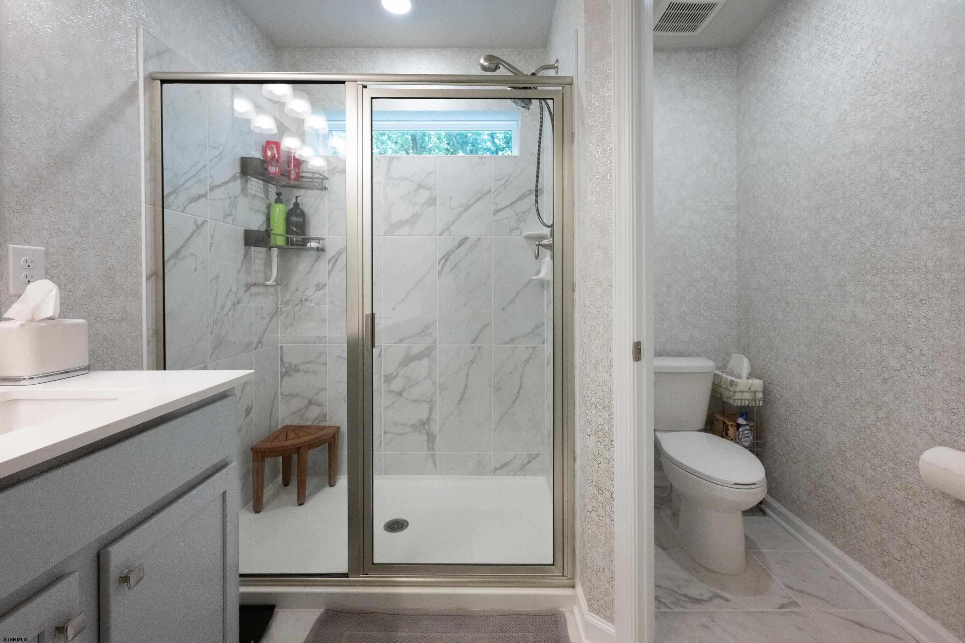 18 Lilac Circle Mount Laurel, NJ 08054 - Photo 33 of 52 a bathroom with a shower and a toilet