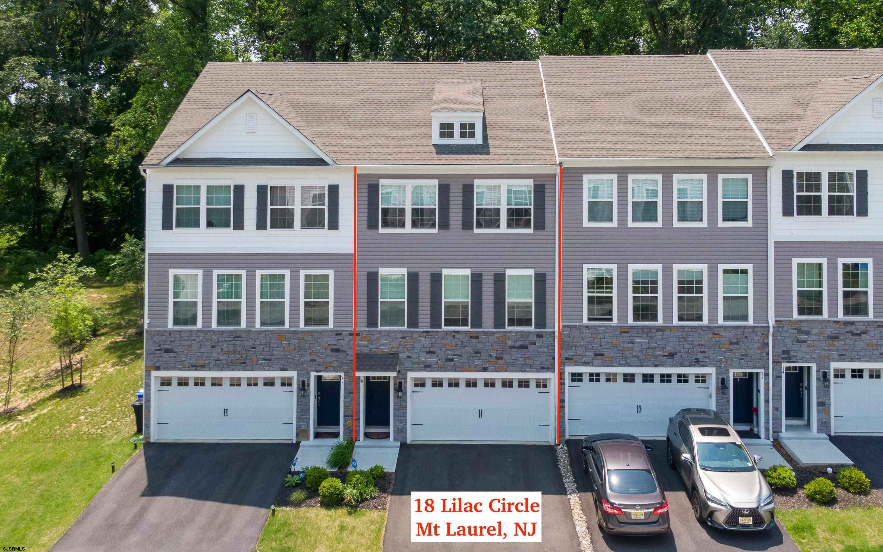 18 Lilac Circle Mount Laurel, NJ 08054 - Photo 44 of 52 a aerial view of a brick house with many windows and yard