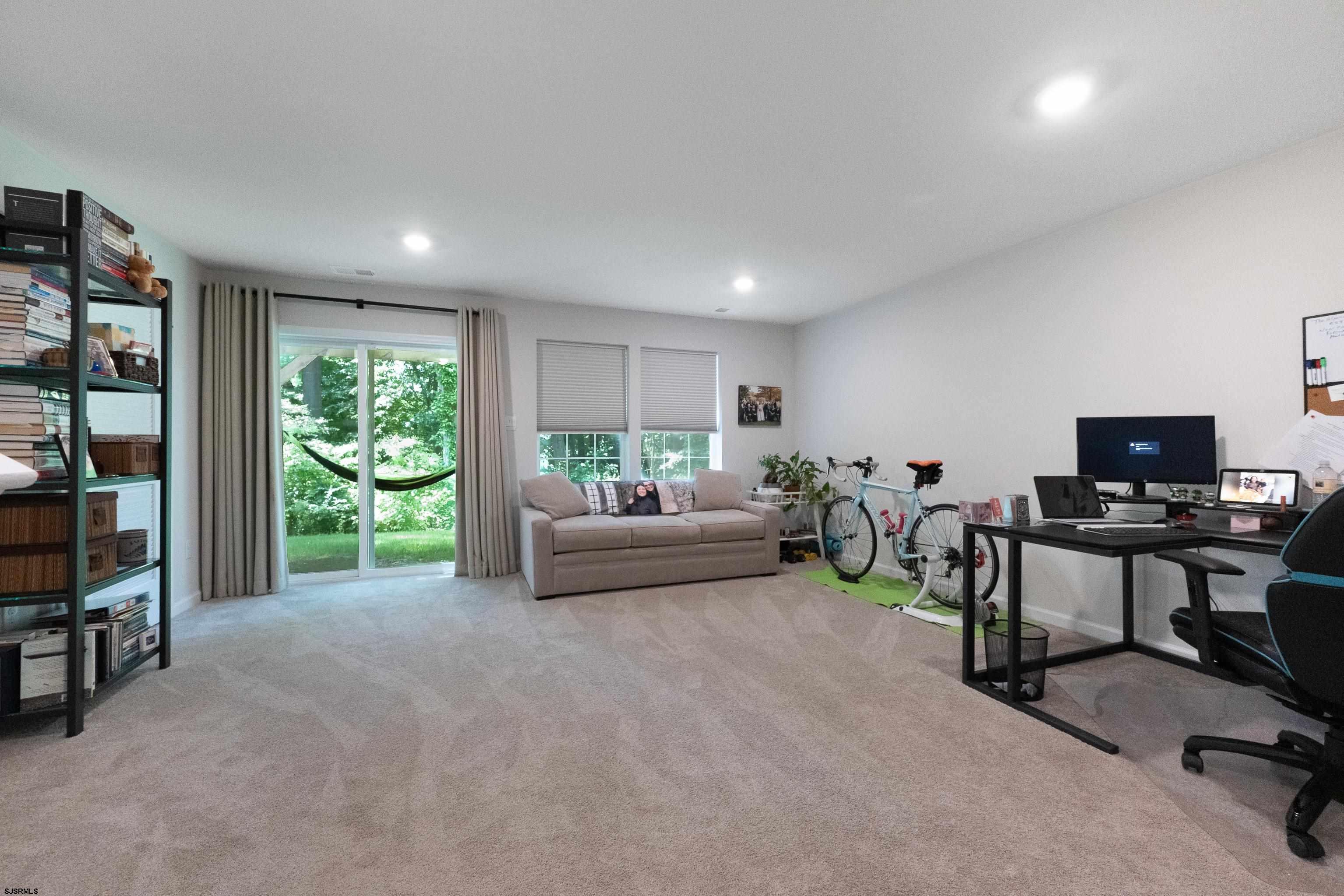 18 Lilac Circle Mount Laurel, NJ 08054 - Photo 8 of 52 a living room with furniture and a flat screen tv