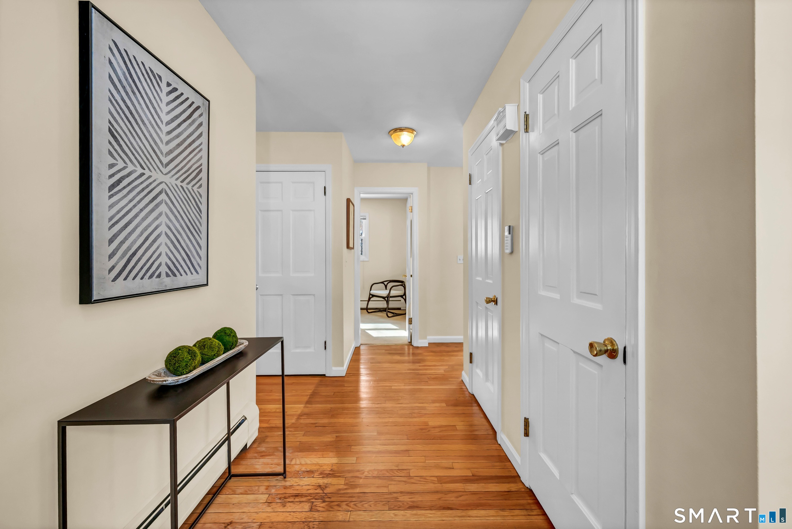 40 Middle River Road Danbury, CT 06811 - Photo 1 of 40 a hallway with wooden floor and closet