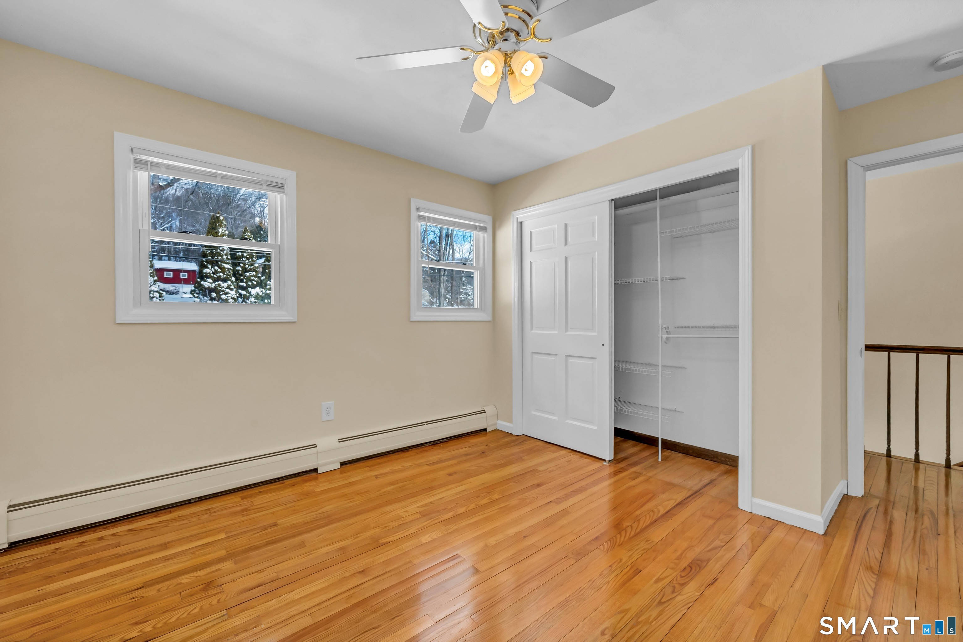 40 Middle River Road Danbury, CT 06811 - Photo 11 of 40 a view of empty room with wooden floor and fan