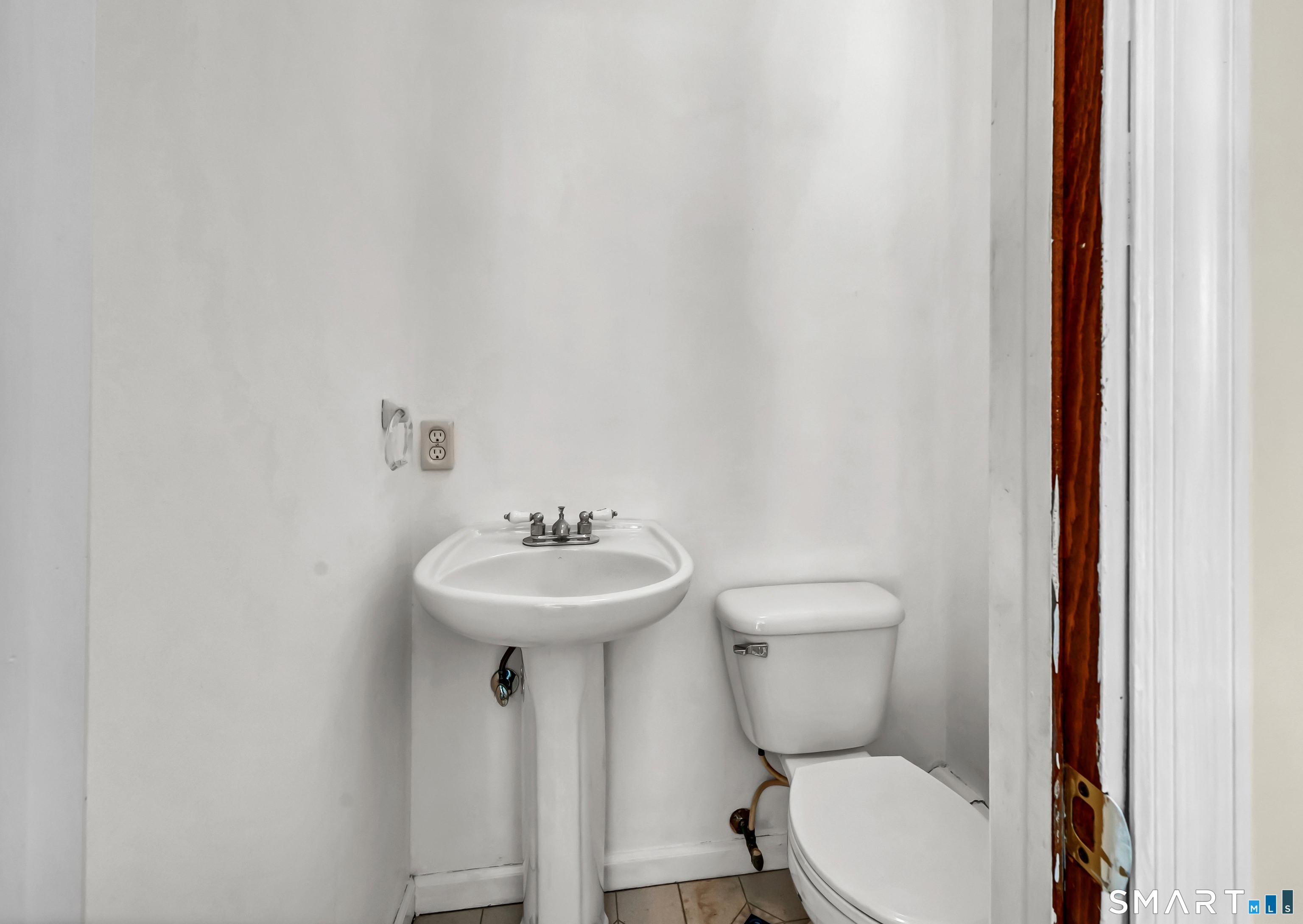 40 Middle River Road Danbury, CT 06811 - Photo 17 of 40 a bathroom with a toilet sink and mirror