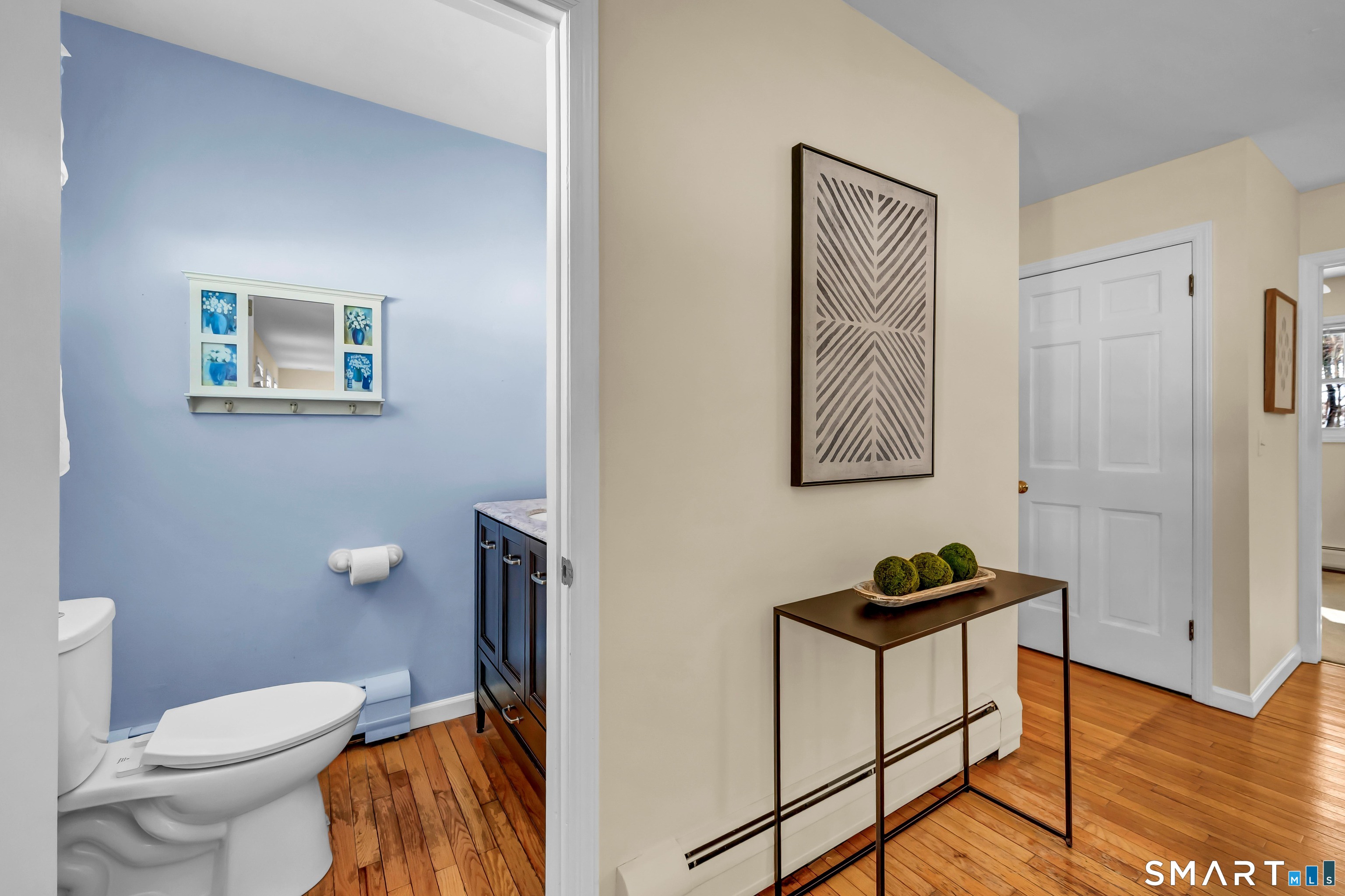 40 Middle River Road Danbury, CT 06811 - Photo 2 of 40 a bathroom with a toilet a sink and mirror