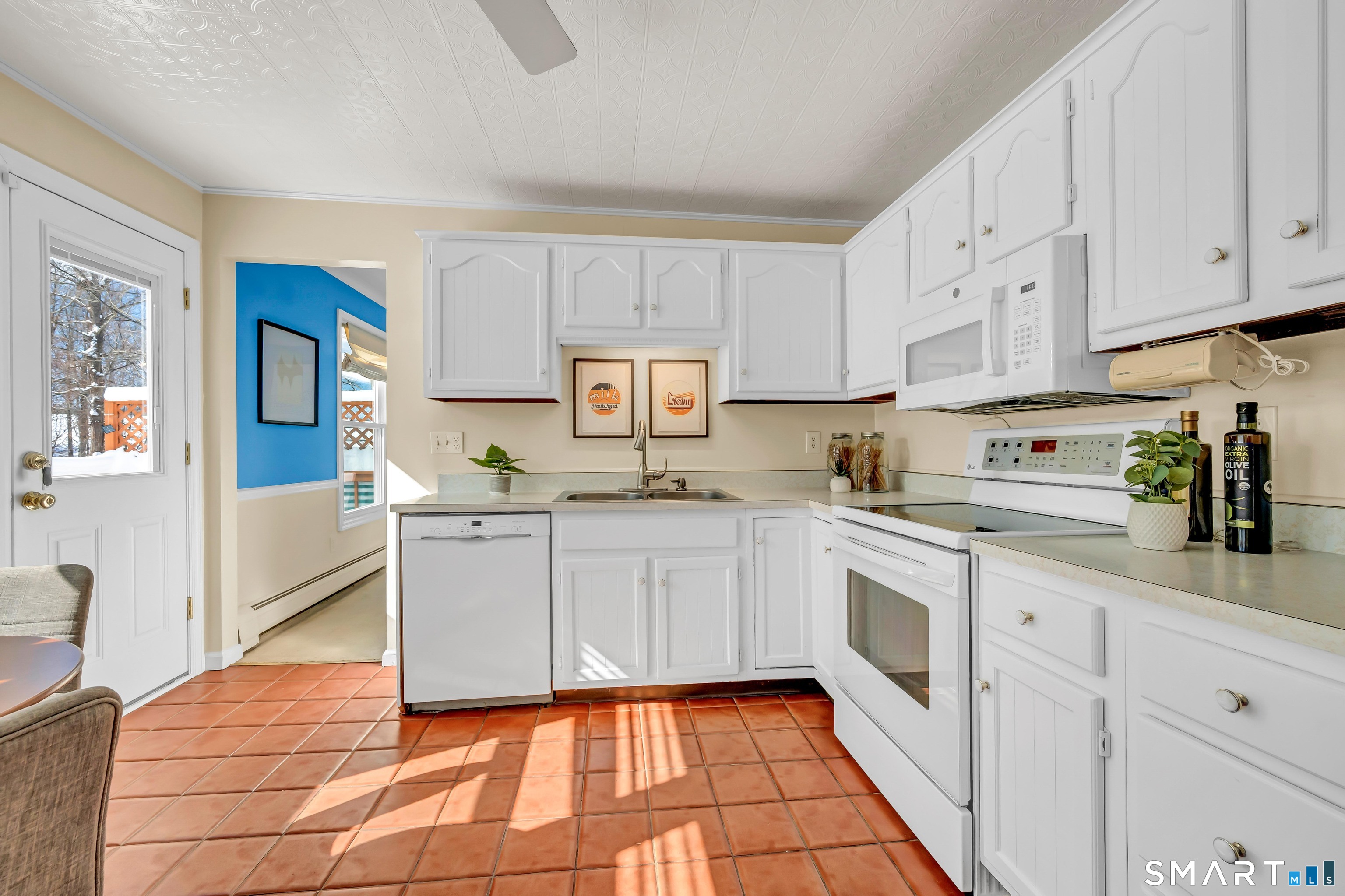 40 Middle River Road Danbury, CT 06811 - Photo 21 of 40 a kitchen with granite countertop white cabinets and white appliances