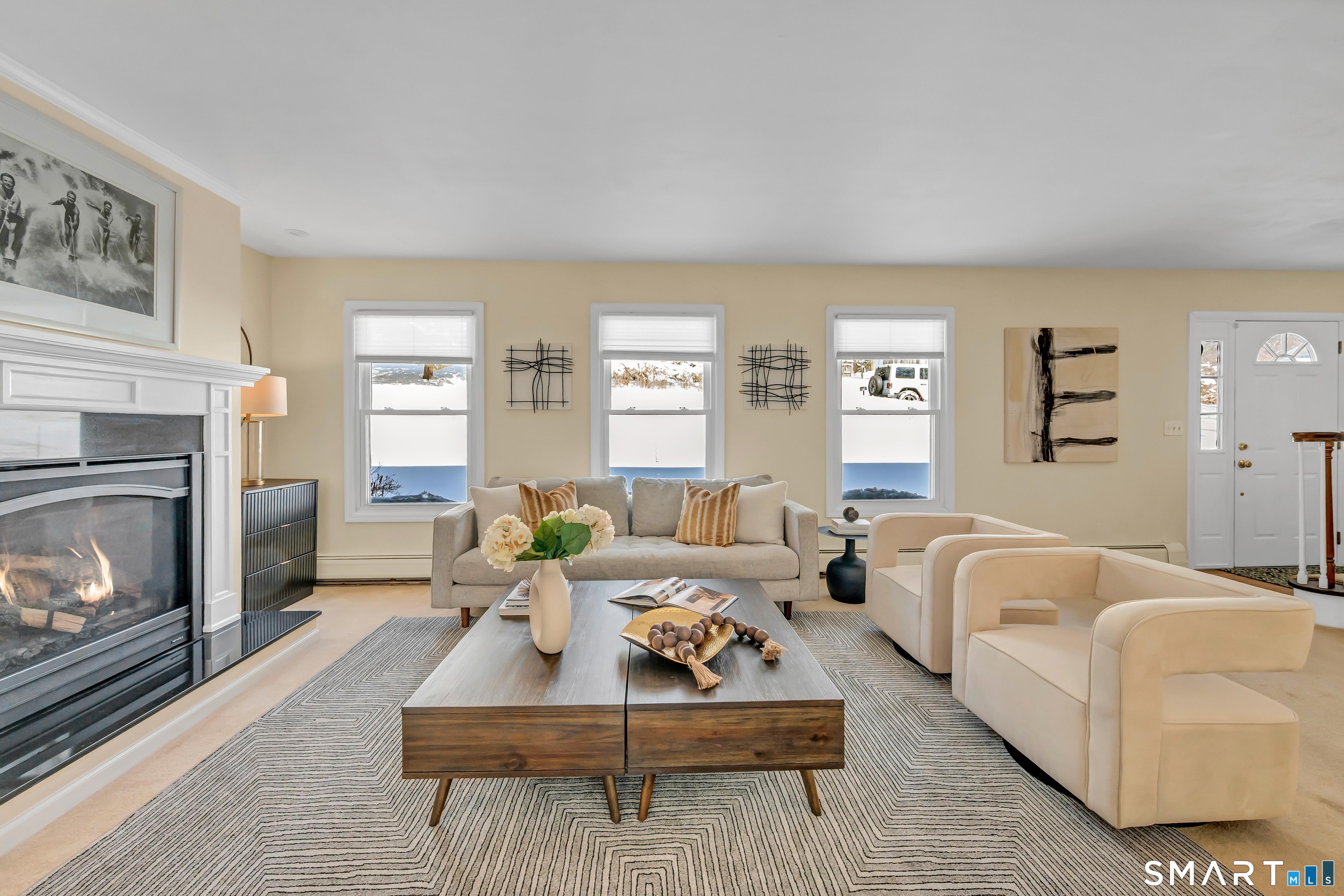 40 Middle River Road Danbury, CT 06811 - Photo 28 of 40 a living room with furniture and a fireplace