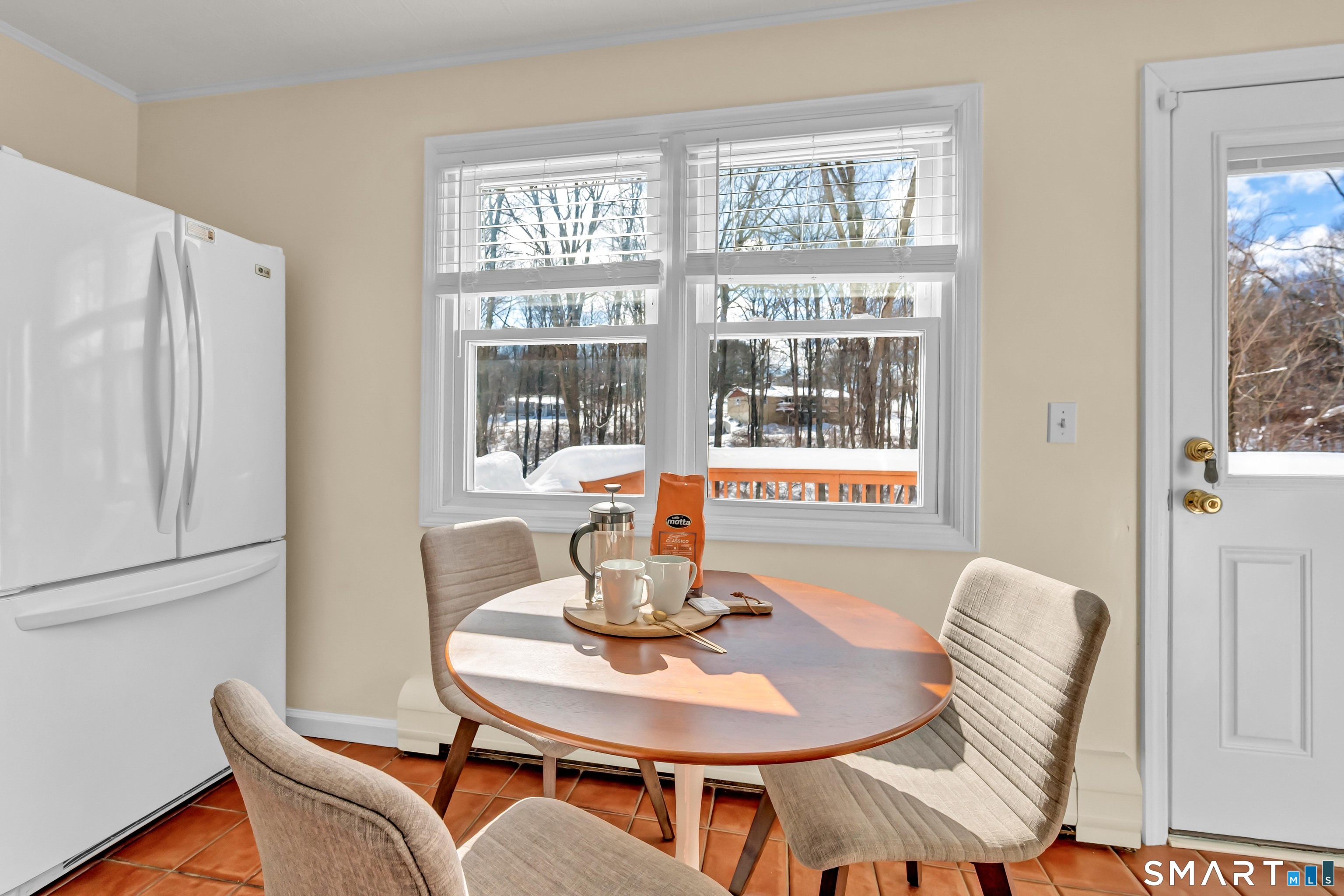 40 Middle River Road Danbury, CT 06811 - Photo 39 of 40 a dining room with furniture a window and wooden floor