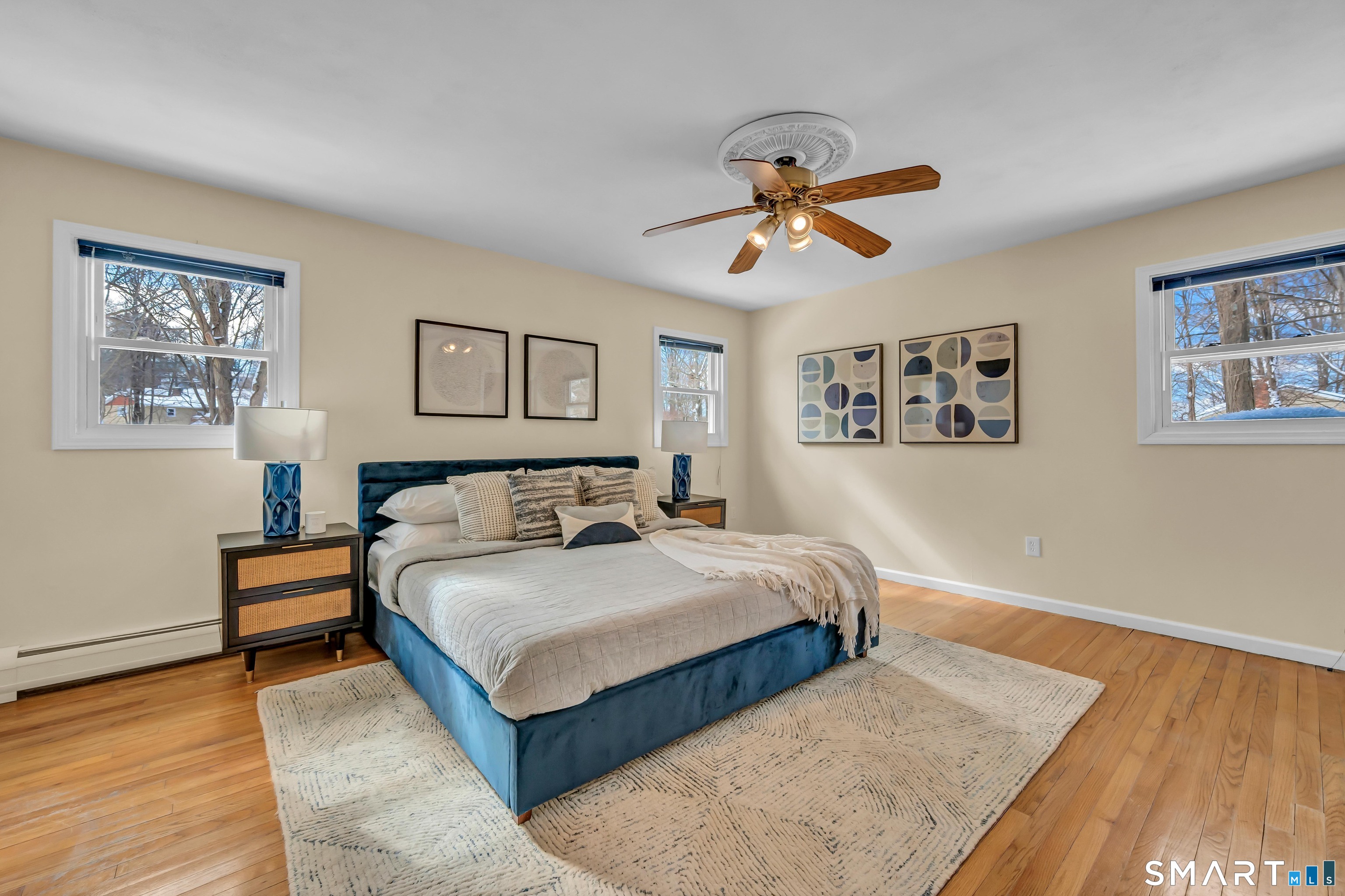 40 Middle River Road Danbury, CT 06811 - Photo 7 of 40 a bedroom with a bed and wooden floor