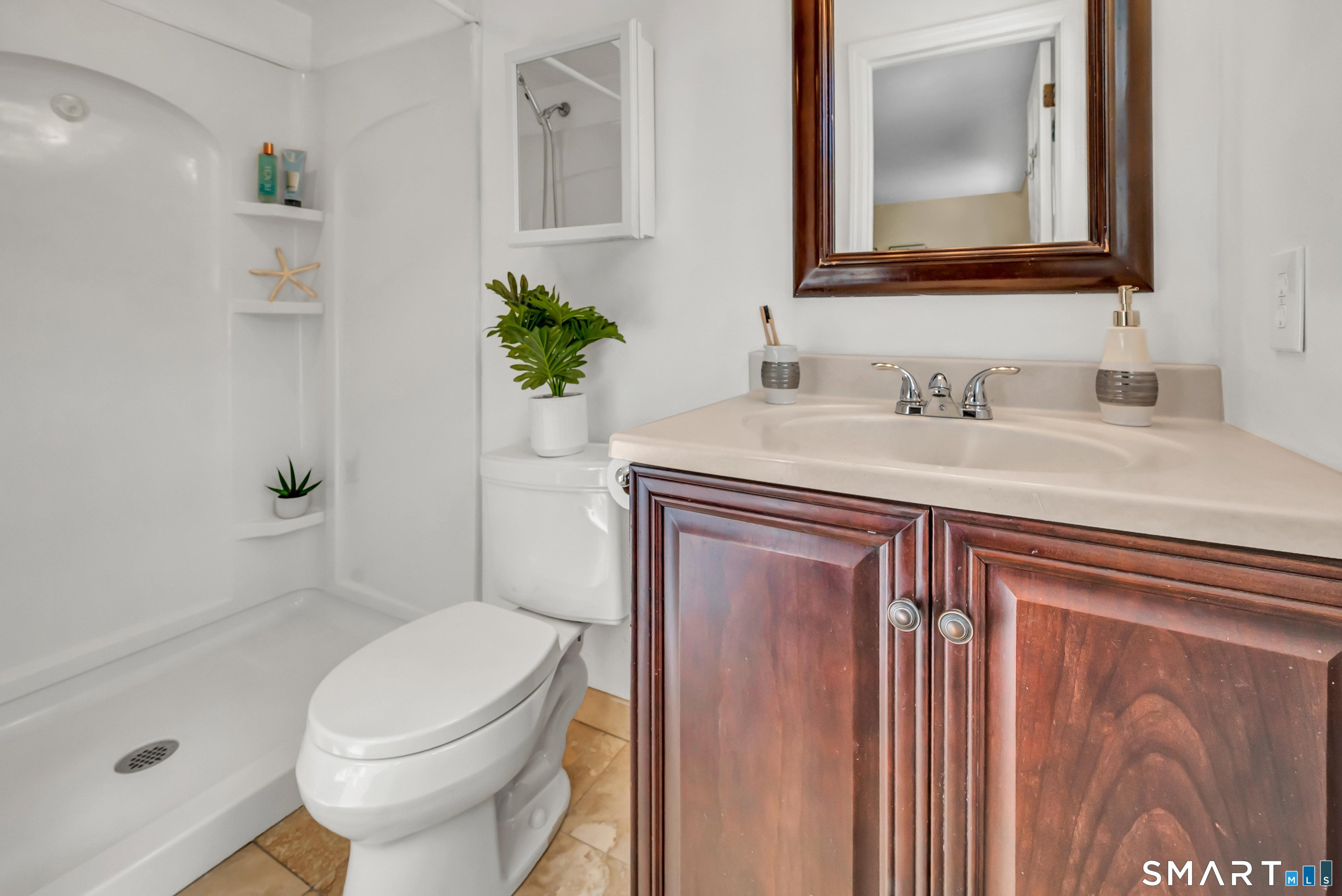 40 Middle River Road Danbury, CT 06811 - Photo 9 of 40 a bathroom with a granite countertop sink a toilet and a mirror