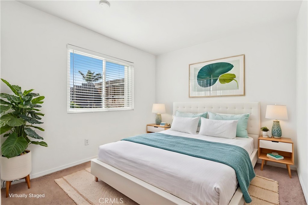 12059 Elk Boulevard Riverside, CA 92505 - Photo 13 of 29 a bedroom with a bed and a potted plant