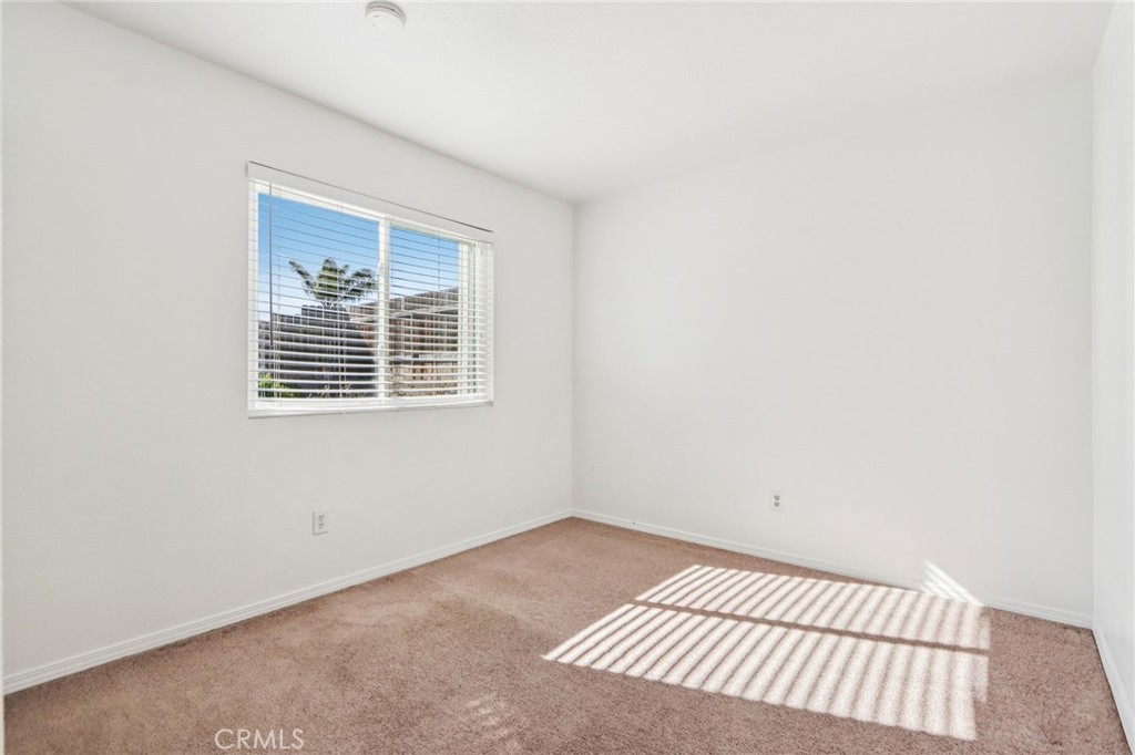 12059 Elk Boulevard Riverside, CA 92505 - Photo 16 of 29 a view of a room with wooden floor and window