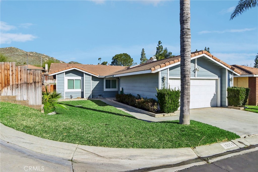 12059 Elk Boulevard Riverside, CA 92505 - Photo 2 of 29 a view of a house with a yard and potted plants