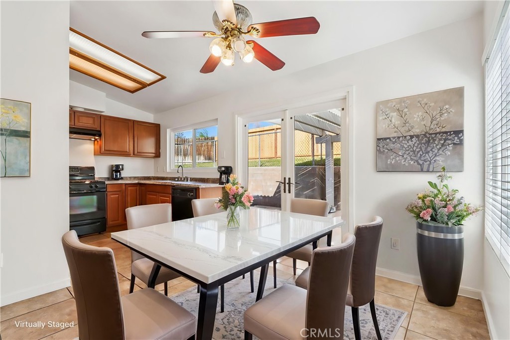 12059 Elk Boulevard Riverside, CA 92505 - Photo 7 of 29 a view of a dining room with furniture window and wooden floor